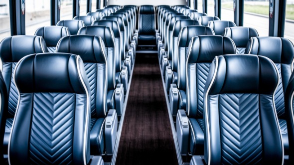 56 passenger charter bus inside the villages